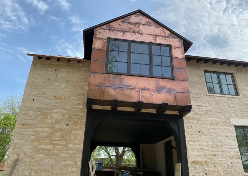 Copper metal panel facade on a stone building for Metal Roof Coating in Saranap