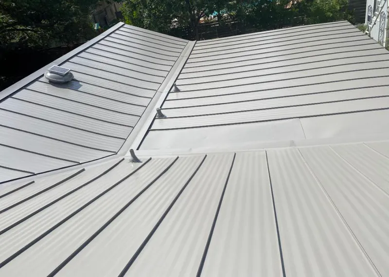 Solar attic fan installed on a metal roof for Roof Ventilation in Saranap